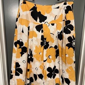 Lucy & Laurel Floral Skirt in Black, White, and Yellow. Below knee length.